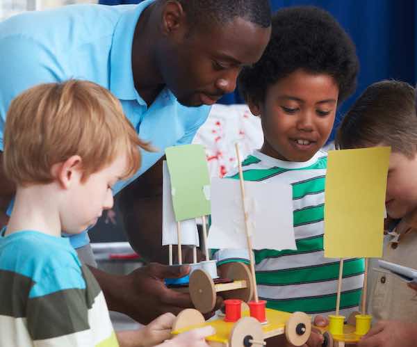 Photo of a teacher facilitating project-based learning, an alternative to teaching the textbook that increases engagement and builds conceptual understanding.